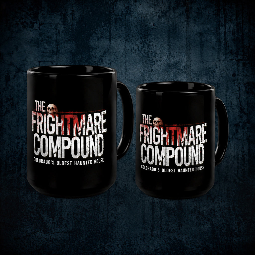 Two black ceramic mugs with custom printed graphics for 'The Frightmare Compound' on a dark textured background.