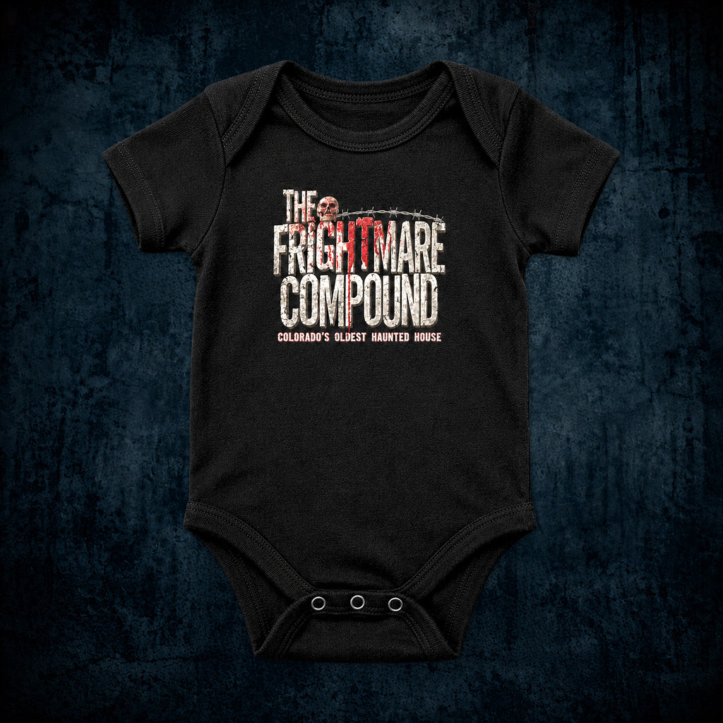 A black short-sleeve baby bodysuit with a distressed graphic print reading 'The Frightmare Compound' and 'Coloma's Slient Haunted House' on the front, displayed against a dark textured blue background.