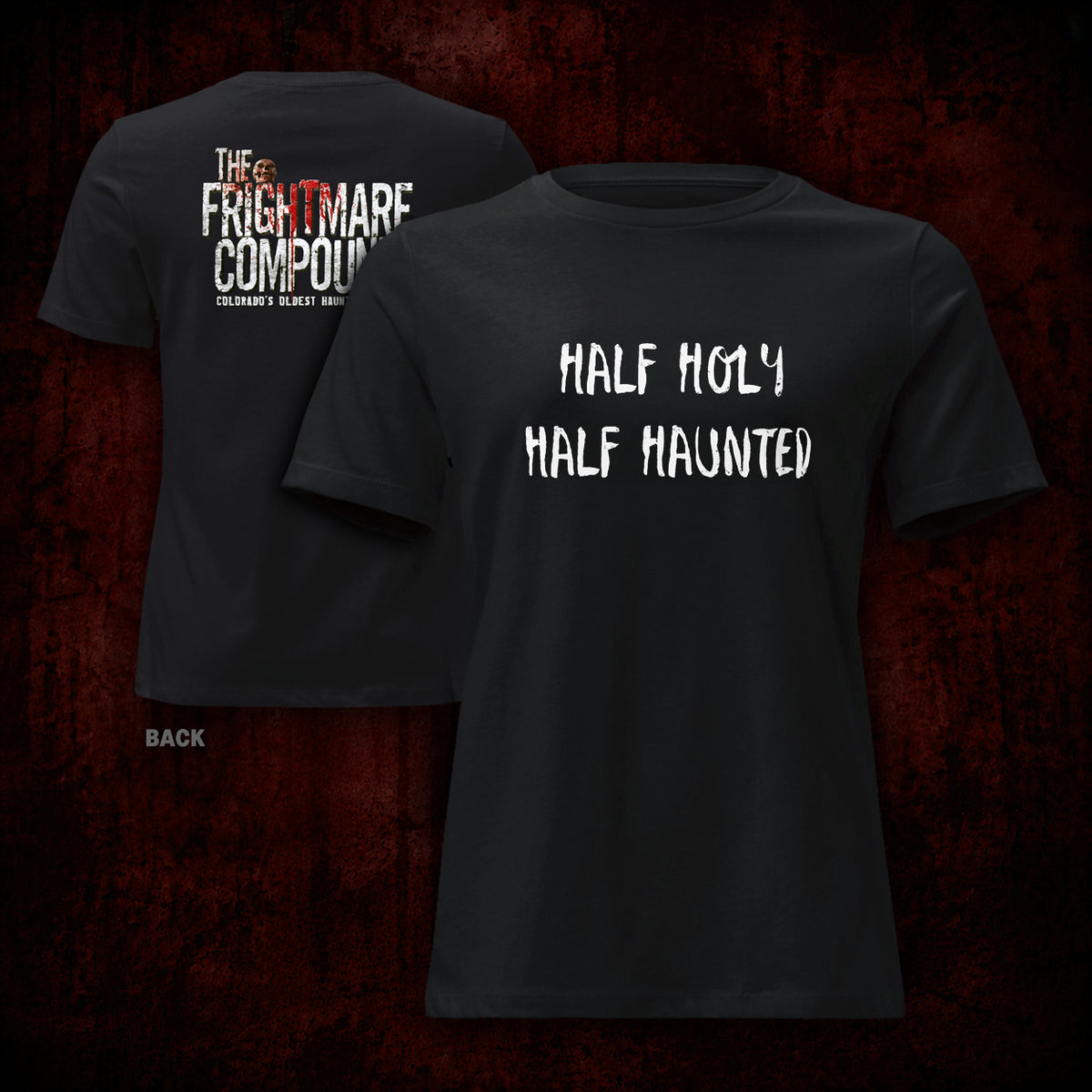 Two black short-sleeve graphic T-shirts shown against a dark red textured background, with the front and back views overlapping. The front shirt has white distressed text reading 'HALF HOLY HALF HAUNTED,' and the back shirt has white and red text reading 'THE FRIGHTMARE COMPOUND' with smaller text below.