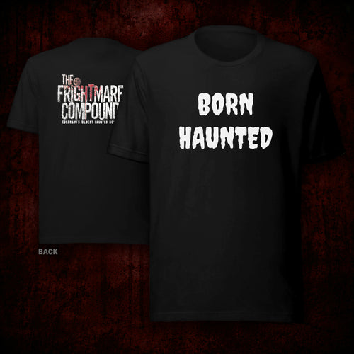 Two black graphic T-shirts shown against a dark red textured background, with the front shirt displaying 'BORN HAUNTED' in large white distressed text and the back shirt displaying 'THE FRIGHTMARK COMPOUND' and smaller text. No person or real environment is present, so this is Product/Packaging.
