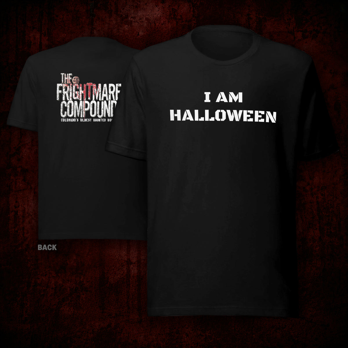 Two black graphic T-shirts shown against a dark red textured background. The front shirt displays the white text 'I AM HALLOWEEN', and the back shirt displays 'THE FRIGHTMARTF COMPOUND' with a small red eye logo and smaller text below.